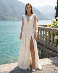 Robe de mariée longue blanche avec fente sensuelle, manches longues avec perles